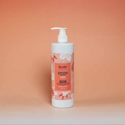 BLUSH clarifying shampoo formulated to remove product buildup, excess oil, and impurities while preparing hair for professional treatments