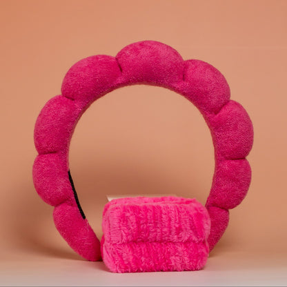 Dark pink BLUSH skincare headband and wristband set designed to keep hair dry and away from the face during skincare routines