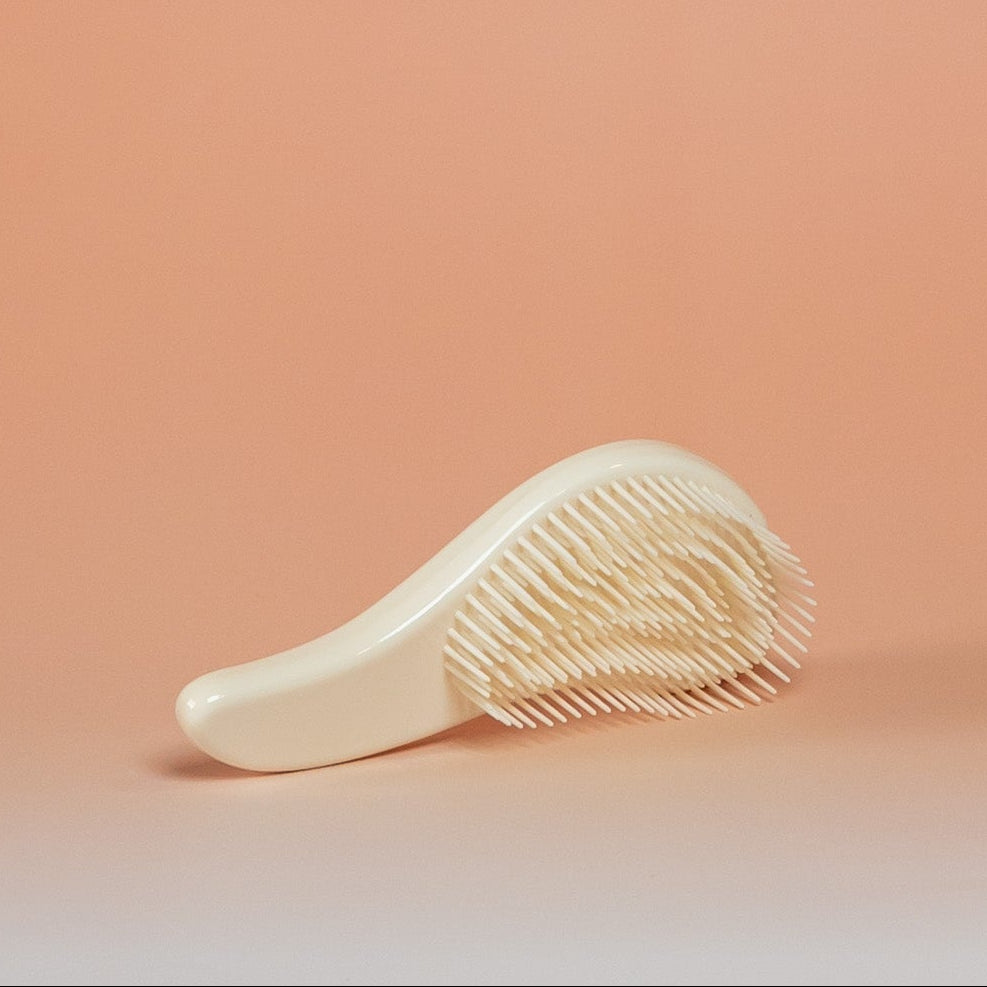 Beige BLUSH detangling brush suitable for dry, damp, or wet hair