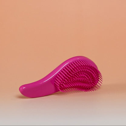Dark pink BLUSH detangling brush designed for dry, damp, or wet hair