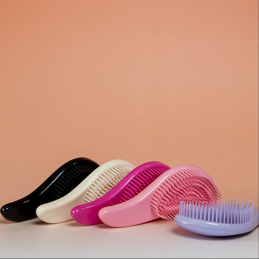 Collection of BLUSH detangling brushes for dry, damp, or wet hair.