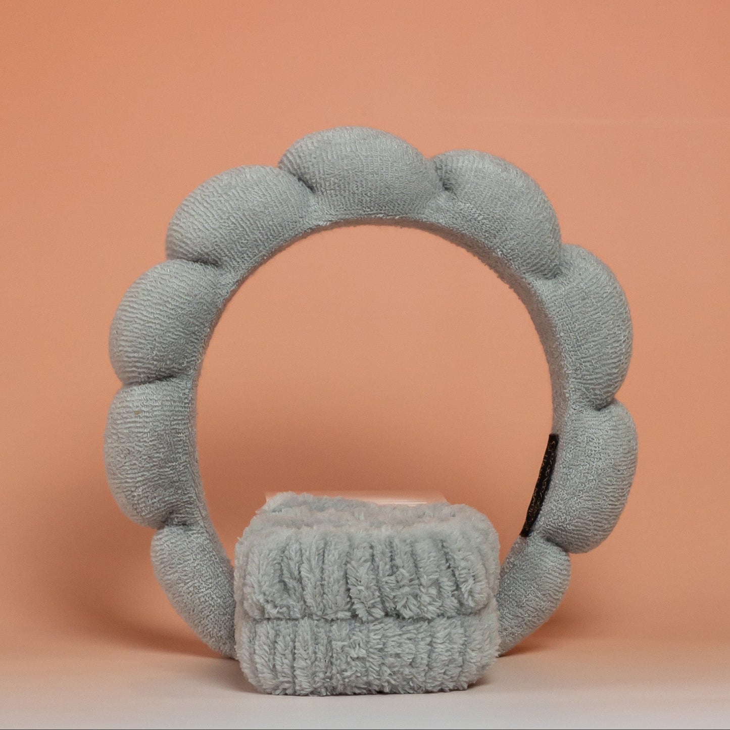 Grey BLUSH skincare headband and wristband set designed to keep hair in place and dry during skincare routines, with a soft, comfortable texture