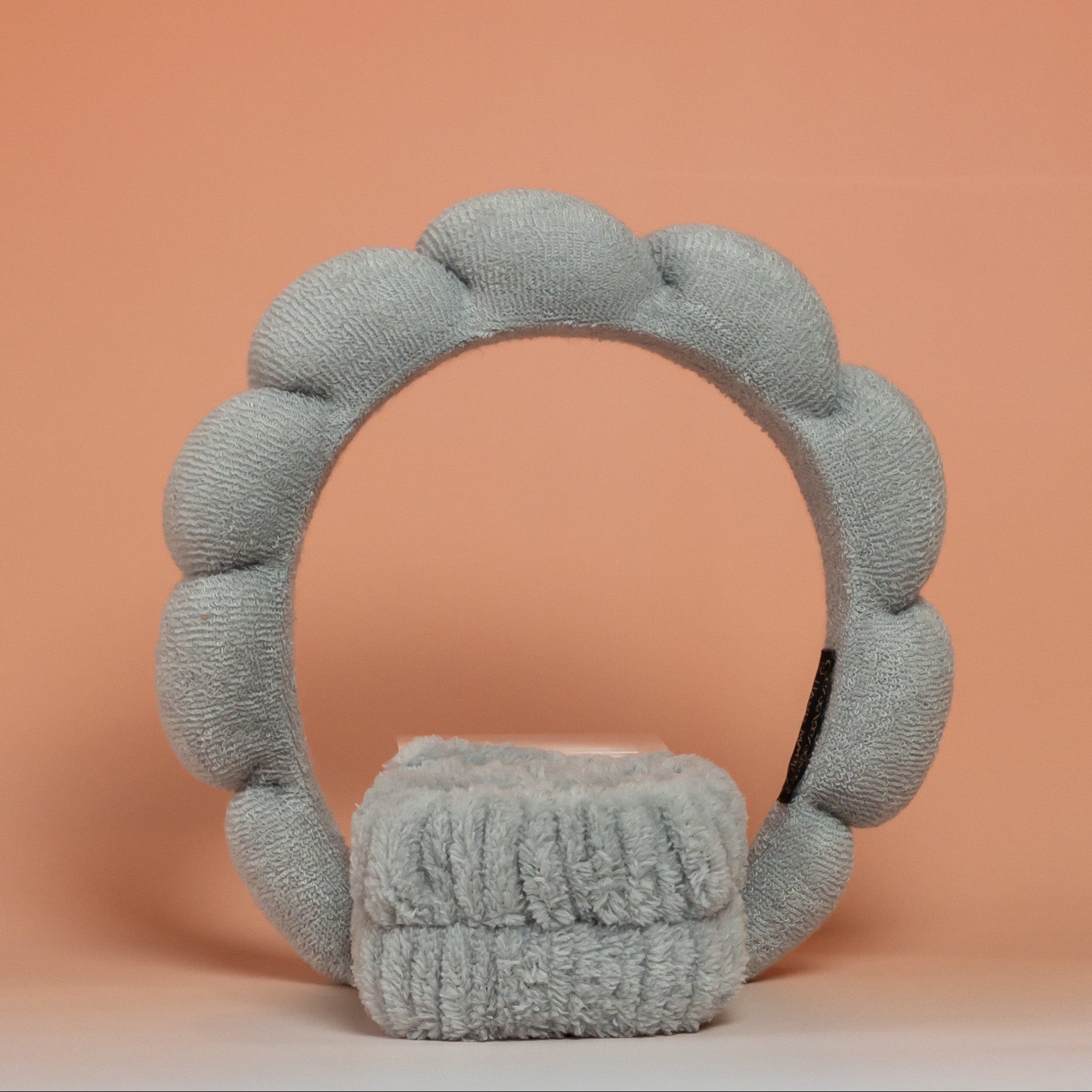 Grey BLUSH skincare headband and wristband set designed to keep hair in place and dry during skincare routines, with a soft, comfortable texture