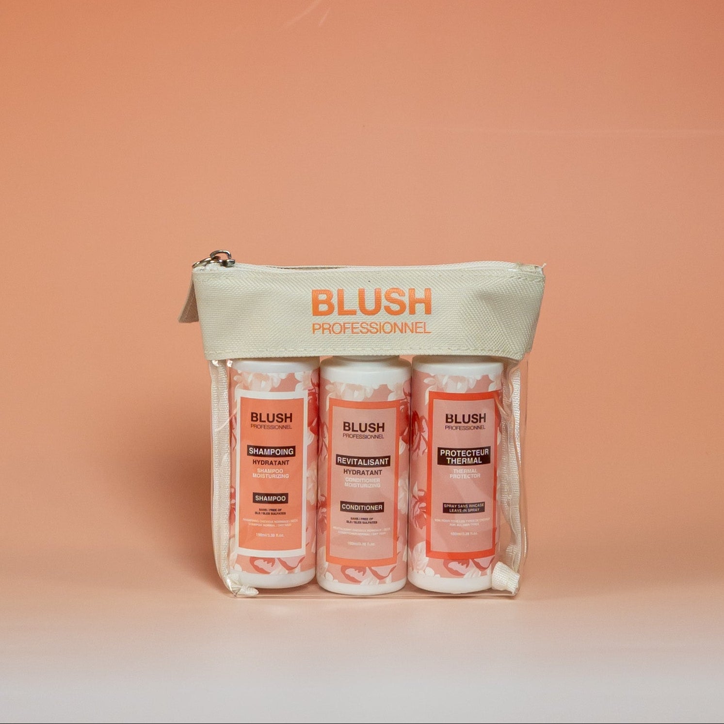 BLUSH travel hair care kit featuring a 100 ml shampoo, conditioner, and heat protectant, designed to keep hair hydrated, soft, smooth, and shiny while traveling