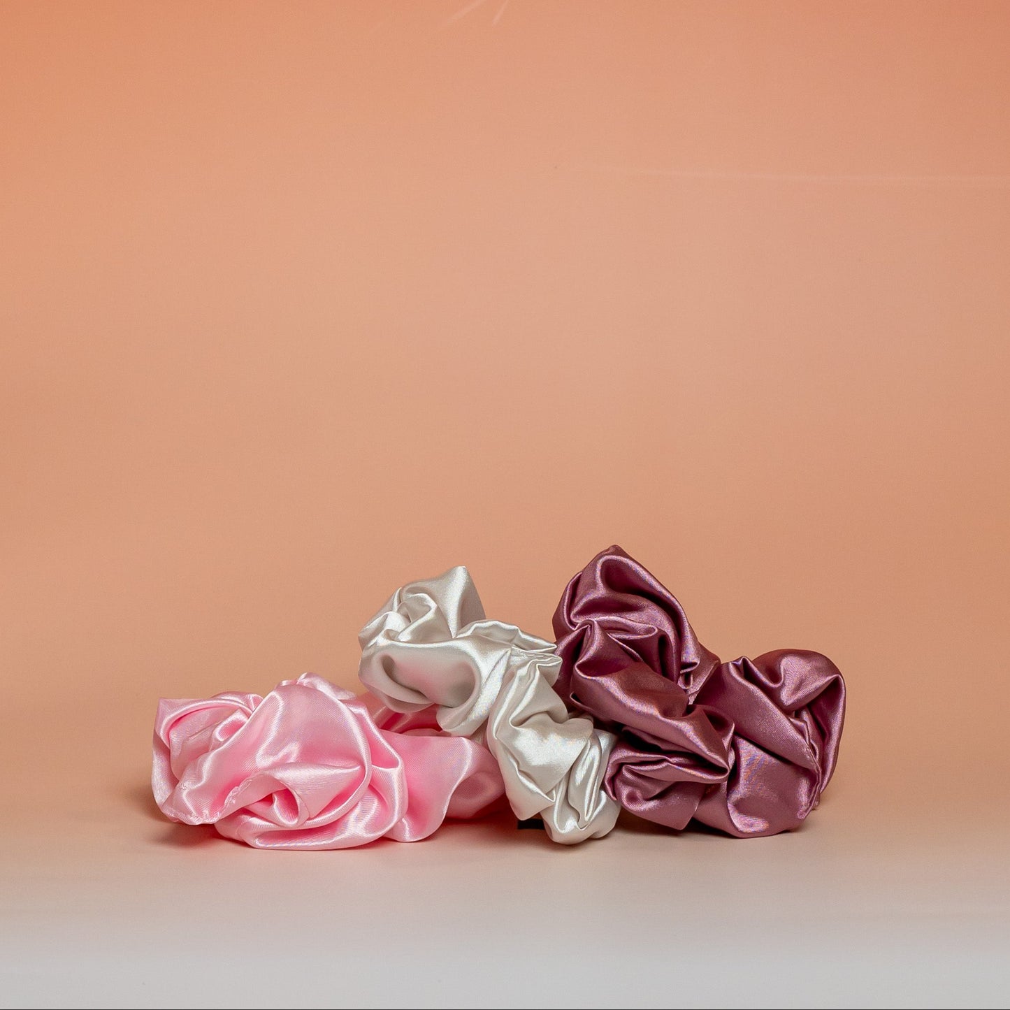 Set of 3 pink BLUSH satin scrunchies that help reduce friction and minimize hair breakage