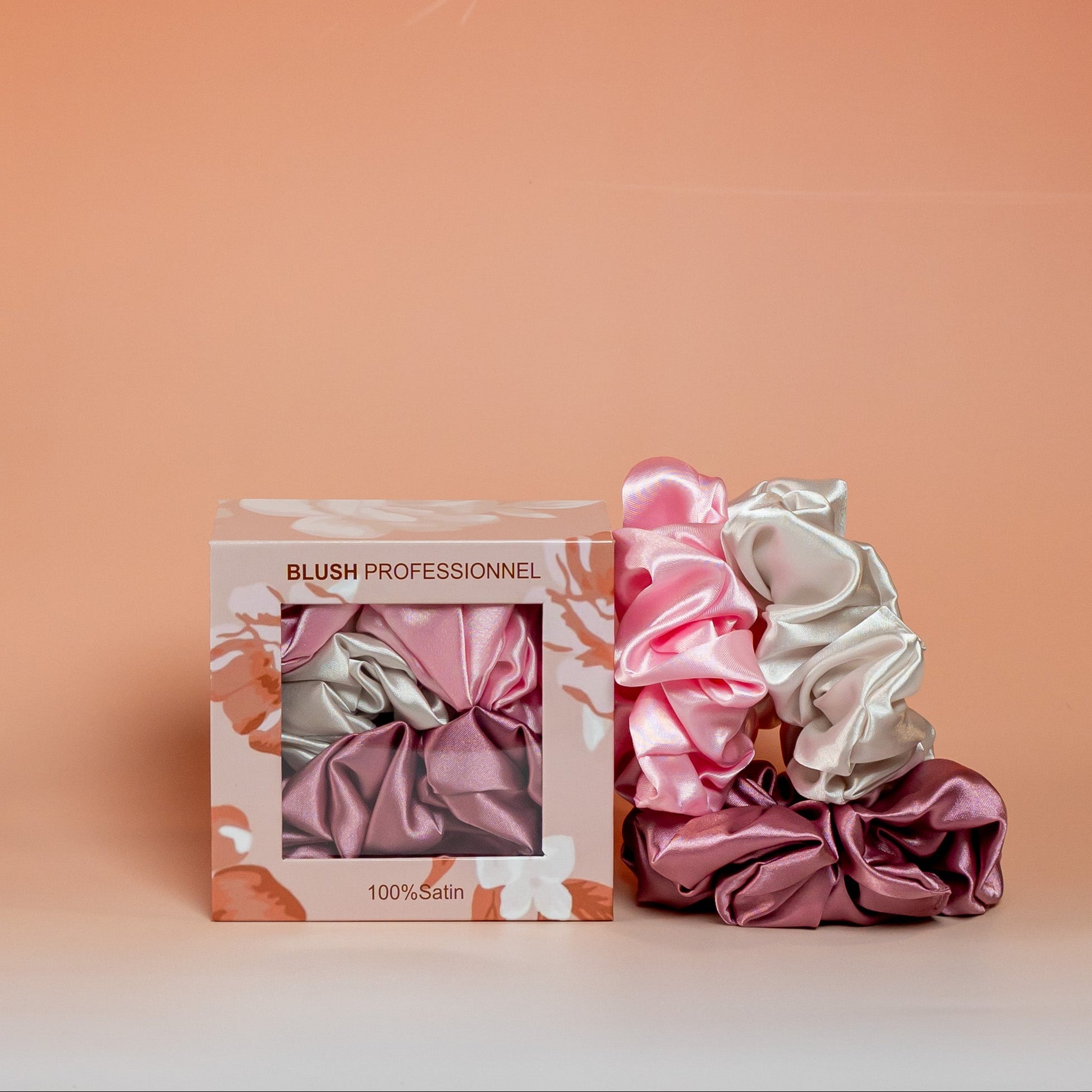 Pink BLUSH satin scrunchies gift box containing 3 satin scrunchies that help reduce friction and minimize hair breakage