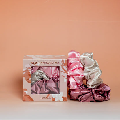 Pink BLUSH satin scrunchies gift box containing 3 satin scrunchies that help reduce friction and minimize hair breakage