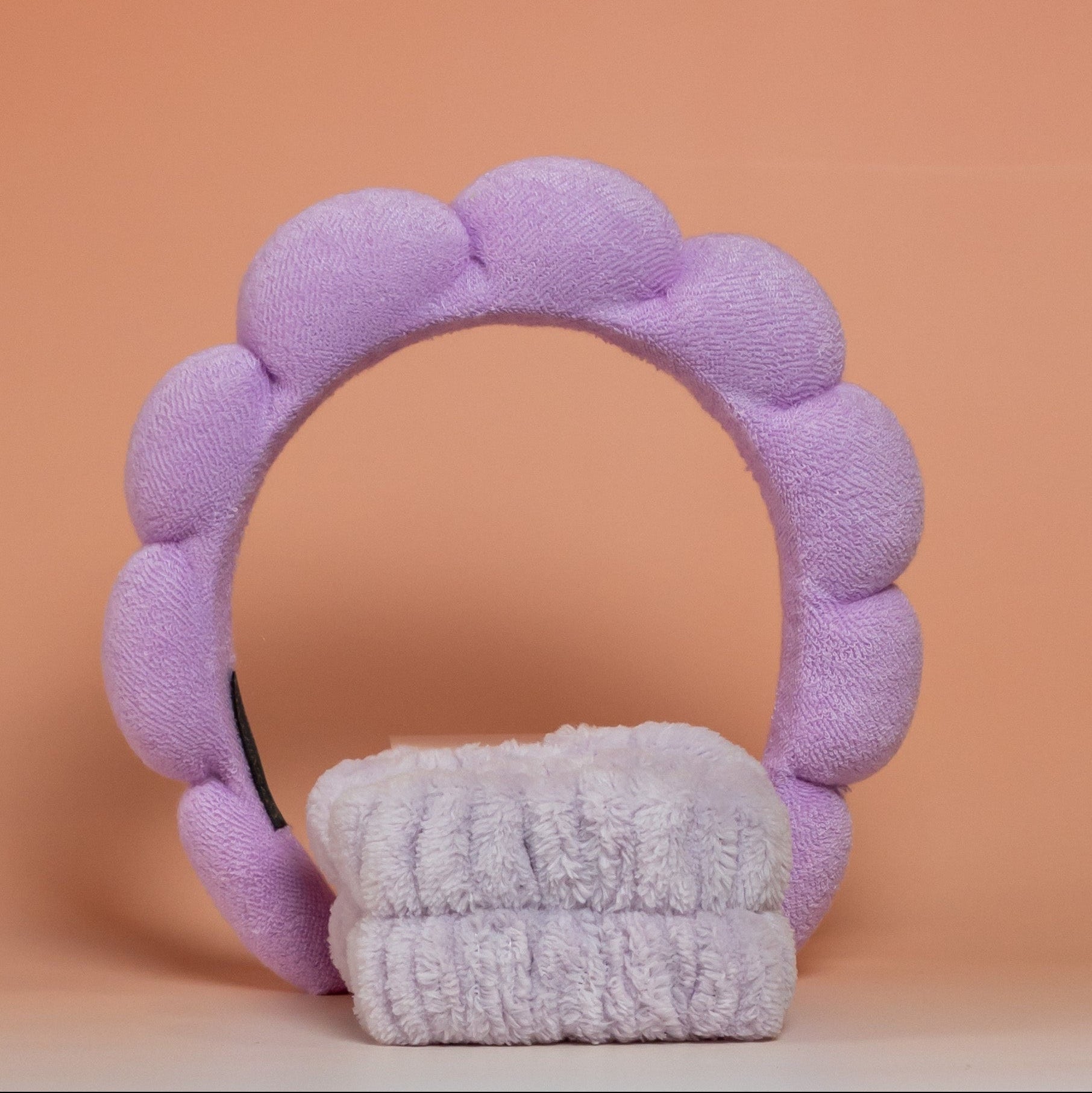 Purple BLUSH skincare headband and wristband set designed to keep hair away from the face during skincare routines, with a soft, easy-to-clean texture