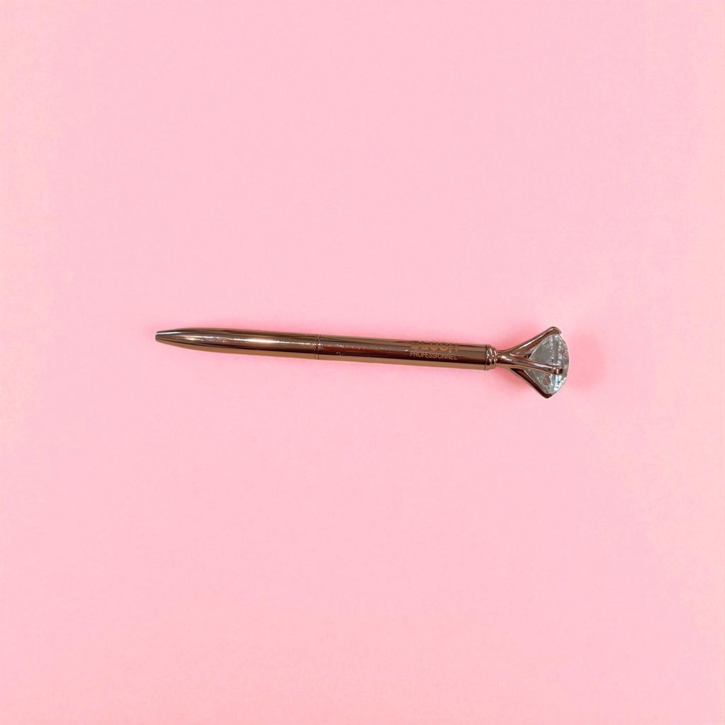 Rose gold BLUSH diamond pen with smooth black ink, designed with a crystal tip for elegant and comfortable writing