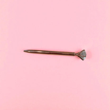 Rose gold BLUSH diamond pen with smooth black ink, designed with a crystal tip for elegant and comfortable writing