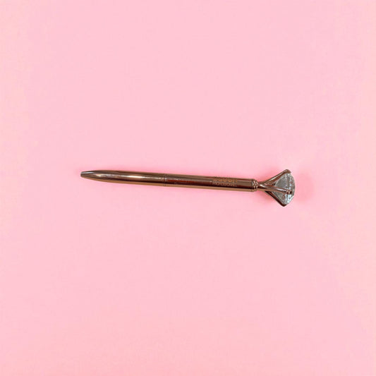 Rose gold BLUSH diamond pen with smooth black ink, designed with a crystal tip for elegant and comfortable writing