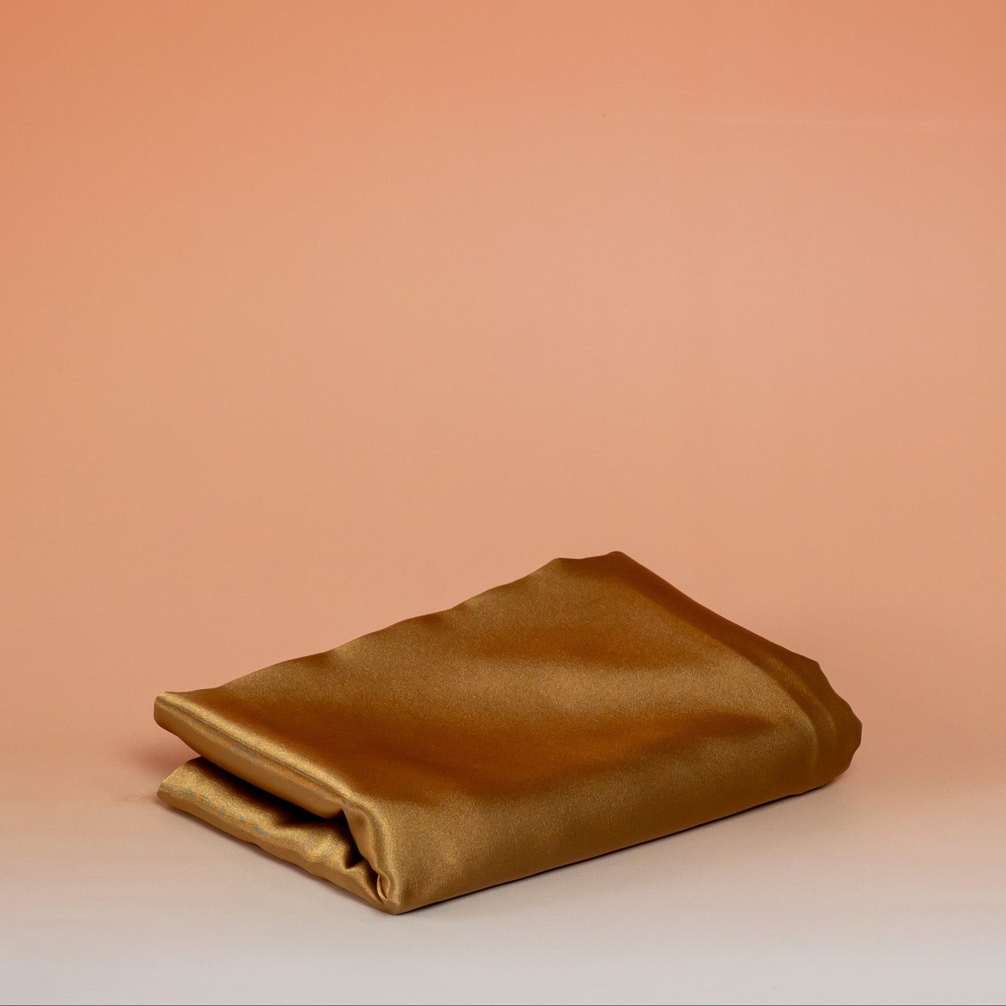 Caramel BLUSH satin pillowcase that helps reduce friction, protect hair and skin, and provide breathable comfort