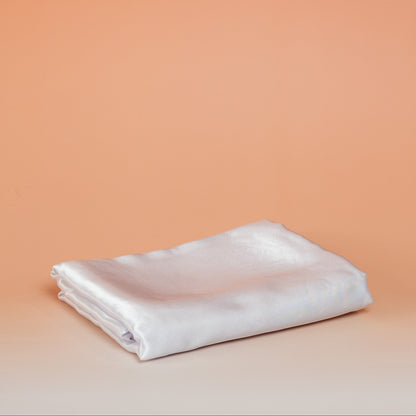 White BLUSH satin pillowcase that helps reduce friction, protect hair and skin, and provide breathable comfort