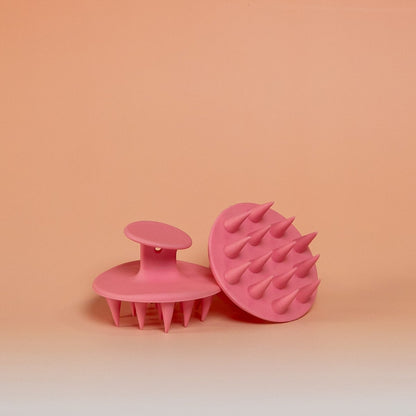 Pink BLUSH silicone scalp scrubber brush that gently massages the scalp, promotes blood circulation, and supports healthy hair growth