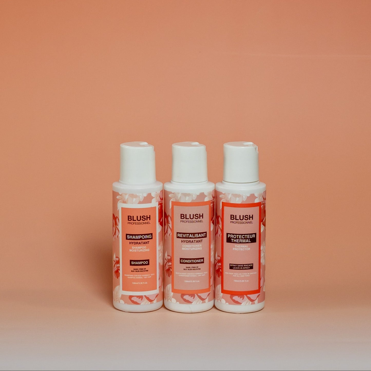 BLUSH travel-size hair care trio including shampoo, conditioner, and heat protectant (100 ml each), designed to hydrate, soften, and add shine to hair
