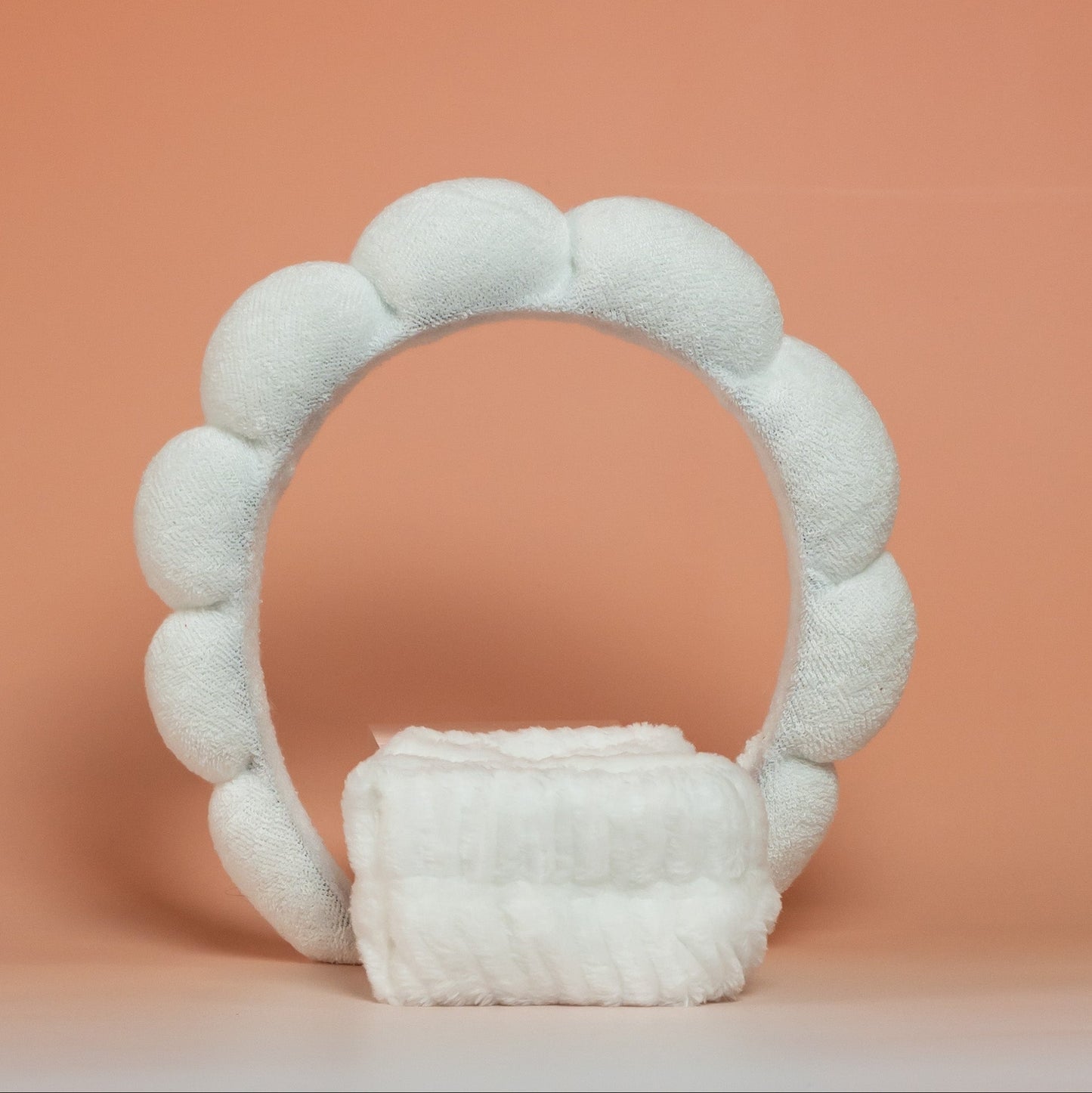 White BLUSH skincare headband and wristband set designed to keep hair dry during skincare routines, with a soft and comfortable texture